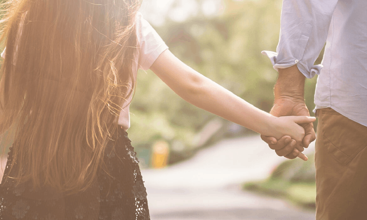 Guiding Your Family Through the First Steps of Funeral Planning Family holding hands.